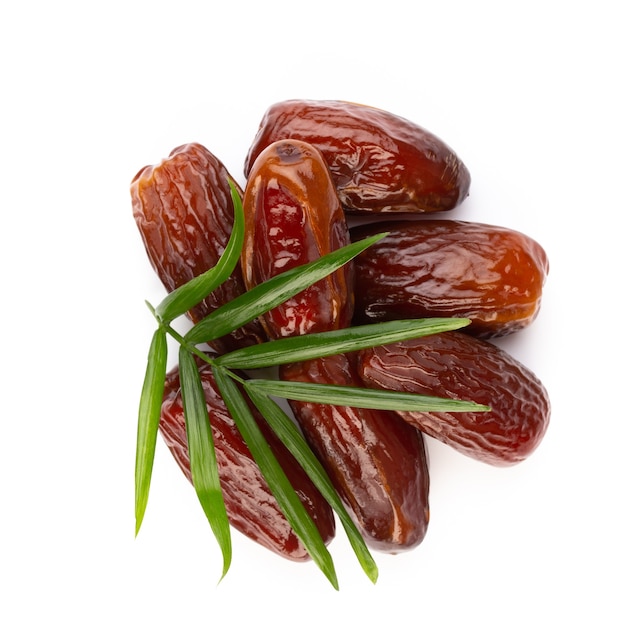 Dry dates isolated on white surface. Top view. Flat lay pattern.