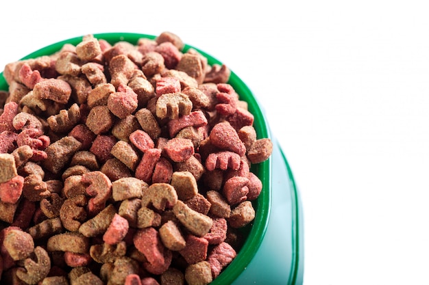 Dry dog food isolated on white