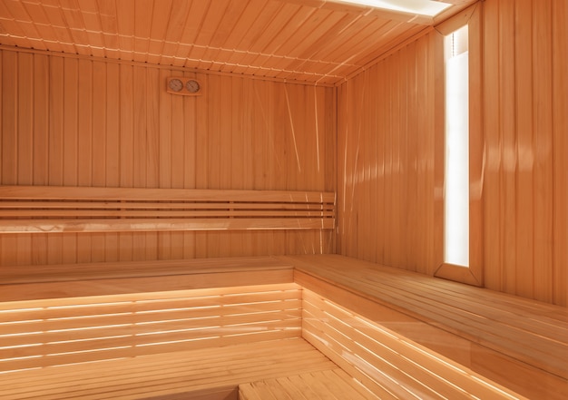 Dry finnish sauna with light wood and window