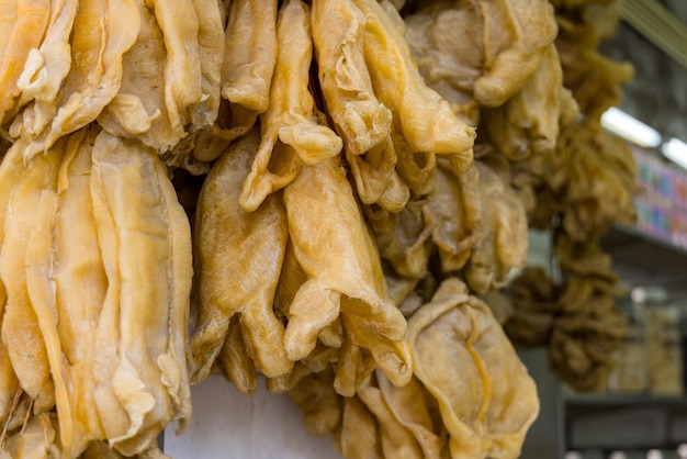 Photo dry fish maw hanging at the store for selling