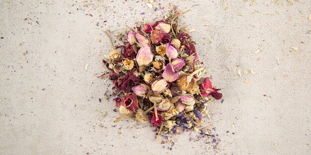 Dry floral tea on white background