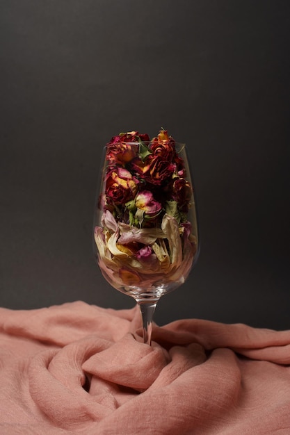 dry flower petals in a glass black background