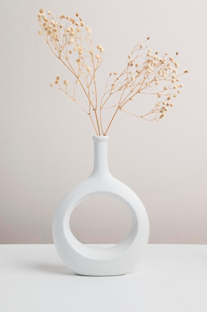 Dry flower in vase nordic vase ceramic in beige background