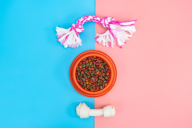 Dry food in bowls with bone