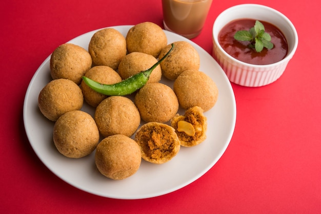 Dry fruit Kachori is small and round shape ball stuffed with masala and cashew etc, served with tomato ketchup and hot tea, Haldiram product