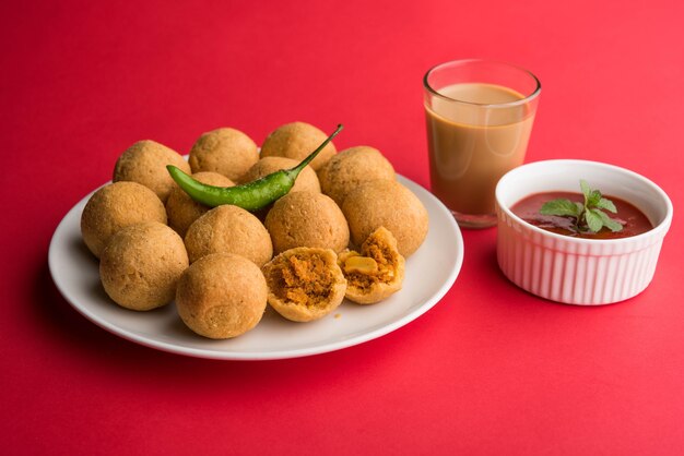 Dry fruit Kachori is small and round shape ball stuffed with masala and cashew etc, served with tomato ketchup and hot tea, Haldiram product