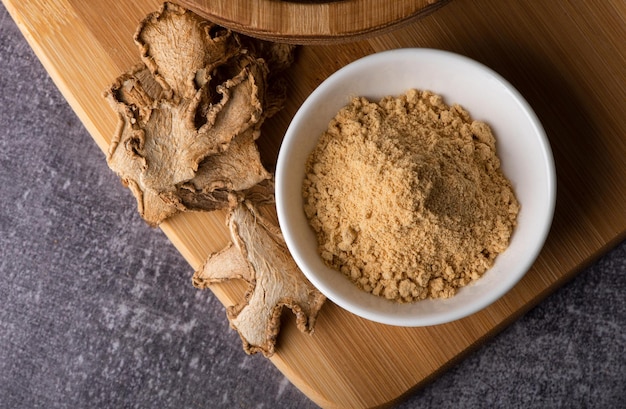 Dry ginger in a spoon Dry ginger powder Ginger dry pieces