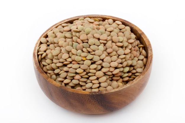 Dry green lentils in bowl