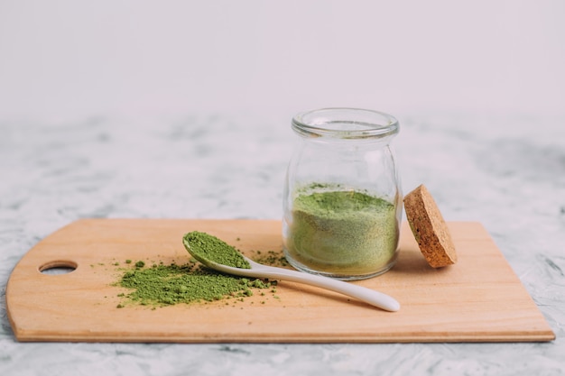 Dry green powder. Traditional chinese matcha for making drinks.