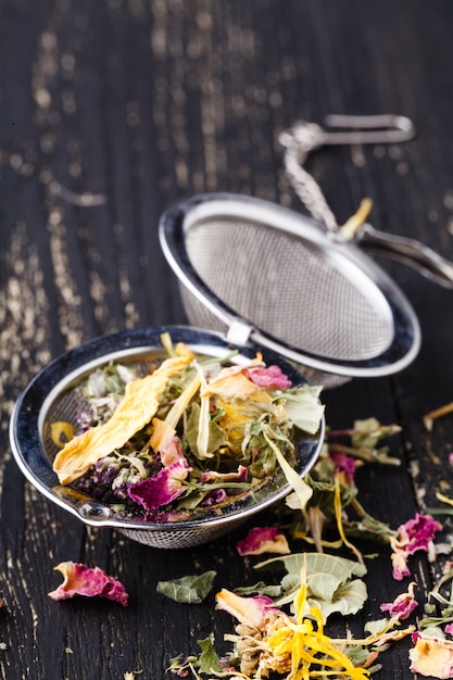 Dry herblal tea lay on wooden table