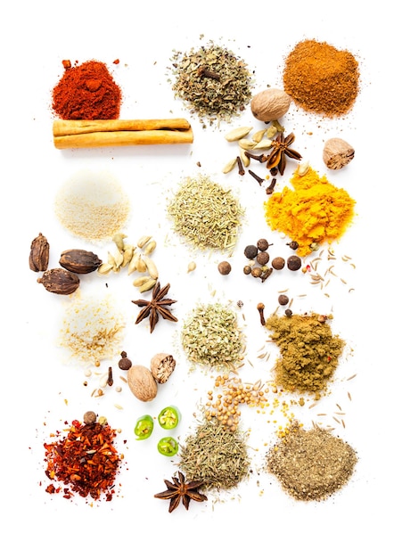 Dry herbs and spices top view, beautiful food concept isolated on white