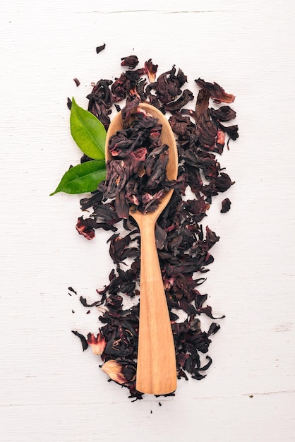 Dry Hibiscus tea On a wooden background Top view Copy space