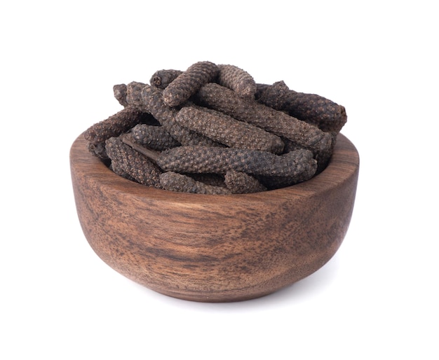 Dry Indian long pepper on a white background. Piper Longum. Piper retrofractum. Herbal medical plant