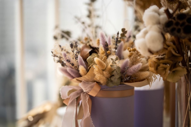 Dry inflorescences are collected in a beautiful composition in a hat box, incredible art