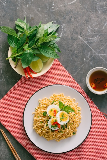 Dry instant noodle - asian ramen and vegetables for the soup