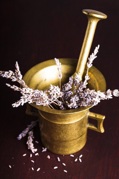 Dry lavender bunch in the copper mortar