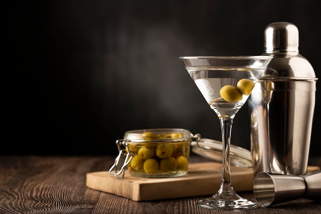 Dry martini drink with green olives