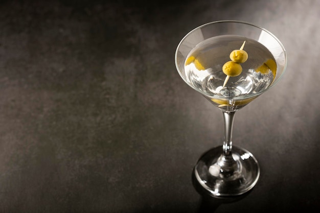 Dry martini drink with green olives