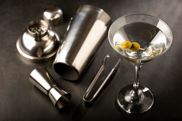 Dry martini drink with green olives