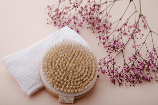 Dry massage brush with natural bristle and towel Scin care concept