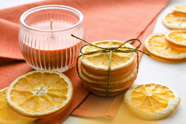 Dry orange slices and candle