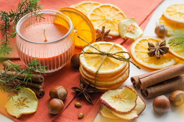 Dry orange slices and candle