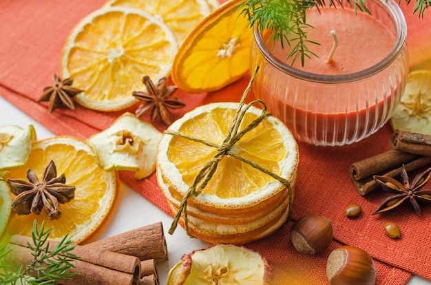 Dry orange slices and candle