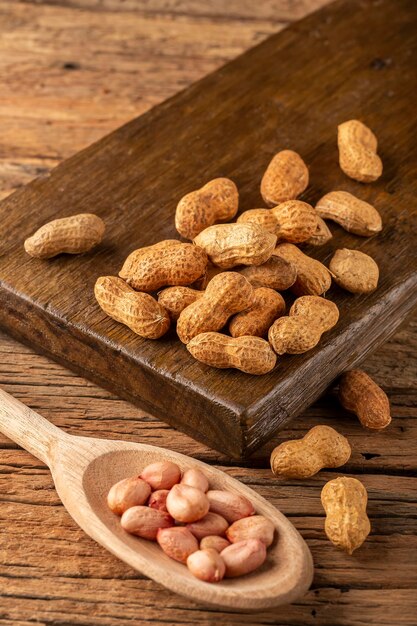 Dry peanut on the wooden background