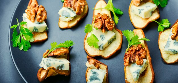 Dry pear,blue cheese and walnut appetizer.Seasonal snack.