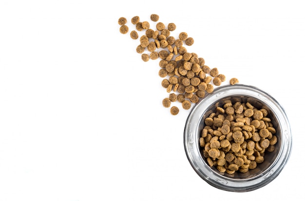 Photo dry pet - dog food in metal bowl, top view