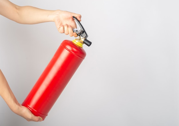 Dry powder fire extinguisher on white background