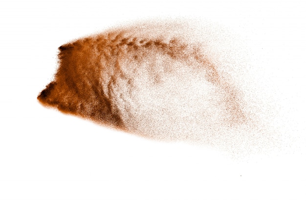 Dry river sand explosion. Brown color sand splash against white background. 