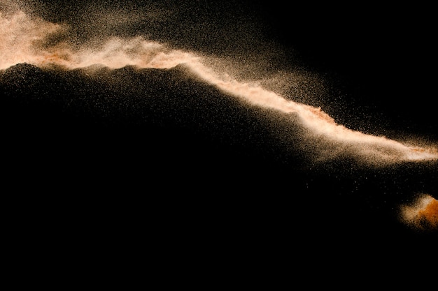 Photo dry river sand explosion isolated on black background
