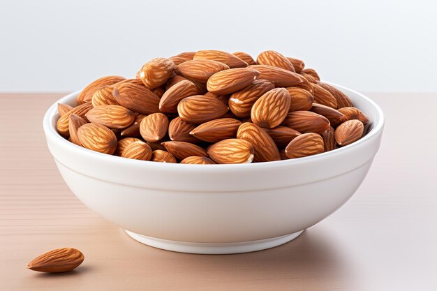 Dry roasted Almonds in white bowl isolated on white background