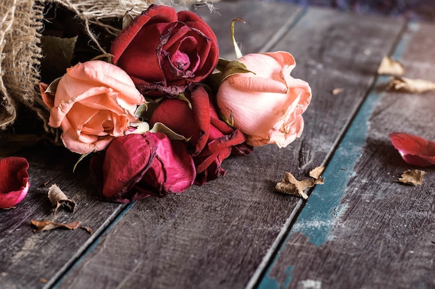 Dry roses on wooden.