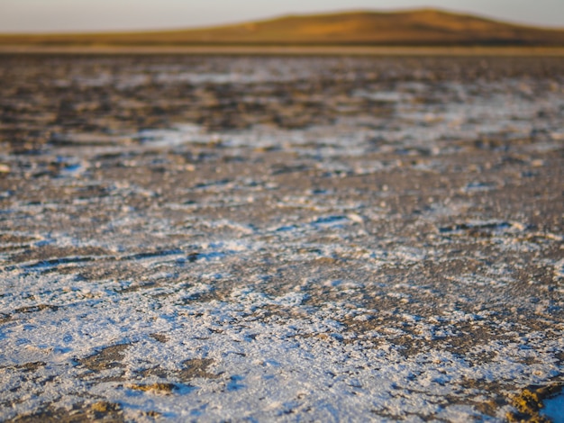 Dry salt lake in our journey. Traces are left by tourists.