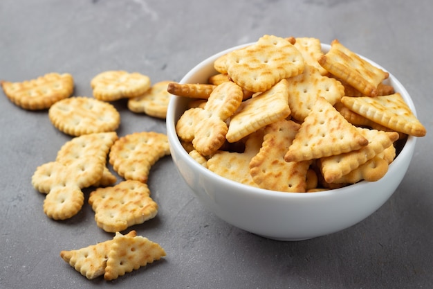 Dry salty cracker cookies on gray stone