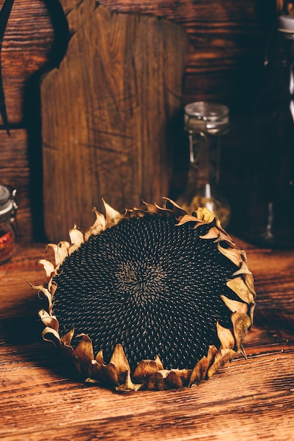 Dry sunflower head on the wooden table