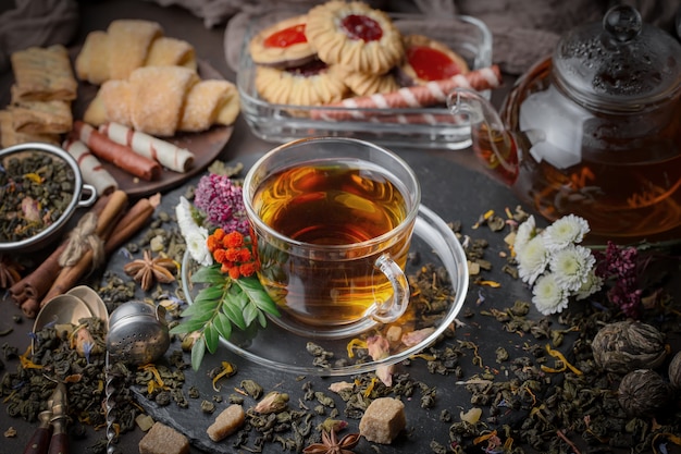 Dry tea leaves on a table on an old background