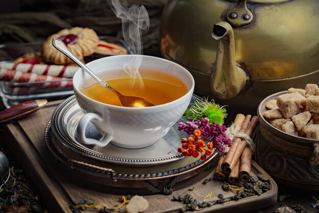 Dry tea leaves on a table on an old background