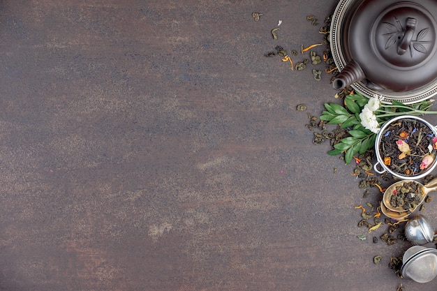 Dry tea leaves on a table on an old background