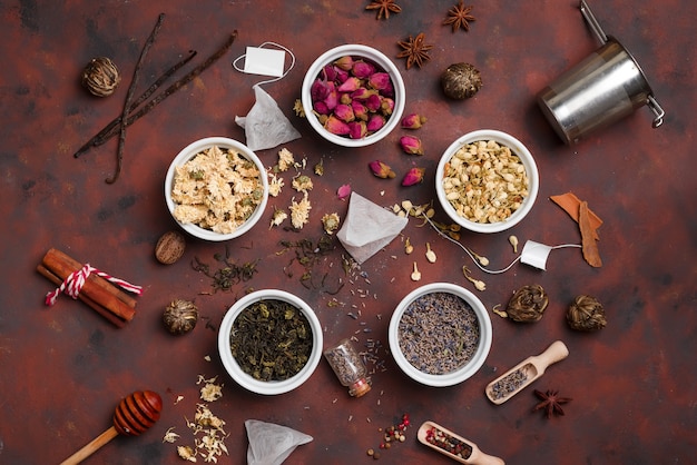 Dry tea with in wooden spoons top view