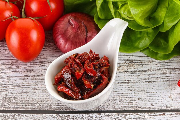 Dry tomato with olive oil in the bowl