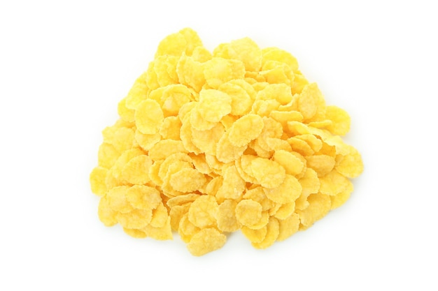 Dry uncooked corn flakes isolated on white