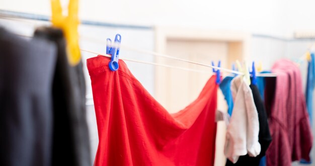 Drying the clothes hanging in laundry, hanging after washing