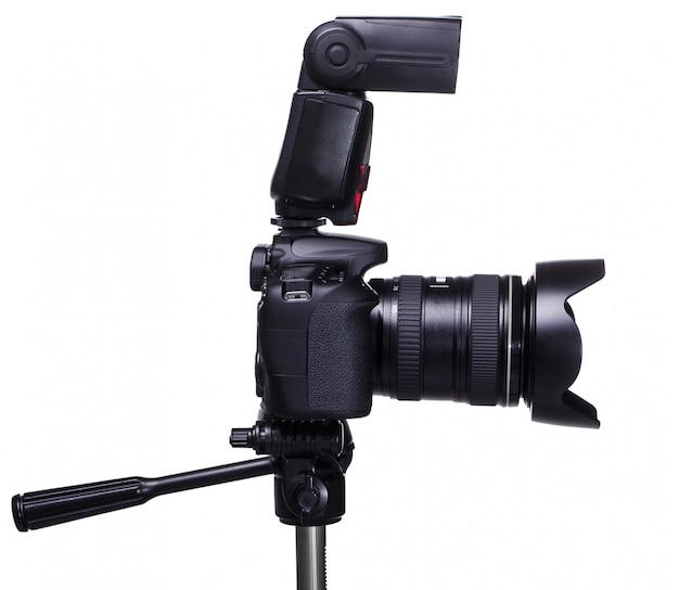 DSLR camera on tripod with external flash