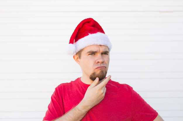 Dssatisfied santa in christmas hat