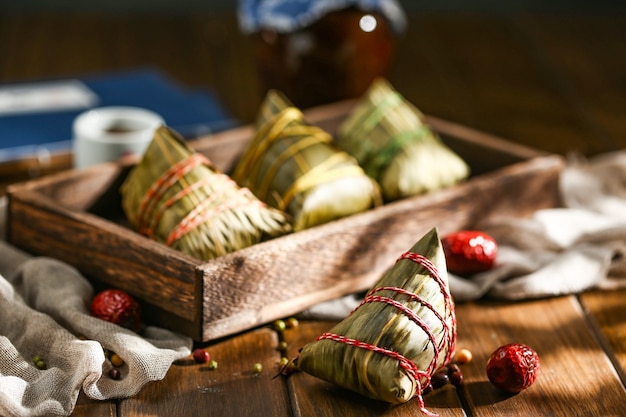 Duanwu festival rice dumplings and rice wine on wooden plate