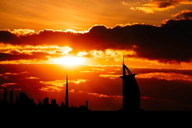 Dubai cityscape silhouette on sunset