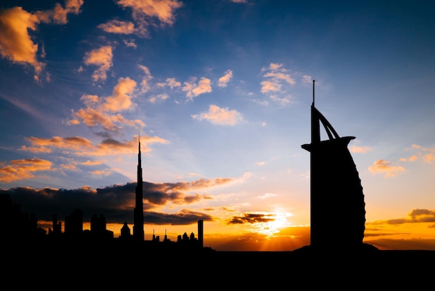 Dubai cityscape silhouette on sunset